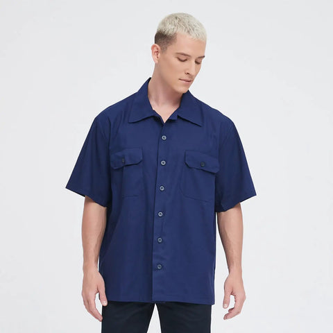 Men's Short Sleeve Work Shirt In Navy Blue Cotton Poly Blend Durable Button Front Uniform Features Double Chest Pockets Built Hella Tough For The Daily Grind And Extra Large Cut, displayed on a male model.