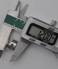 Caliper measuring 12mm cam lock fitting from Cam Lock Fittings For Furniture Connectors Kit 20 Pack 15mm x 12mm