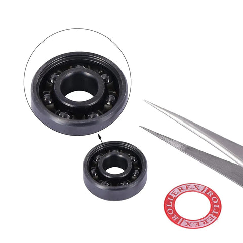 Close-up of Silicon Nitride 608-2RS Ceramic Bearings Pre Lubricated For Skates And Scooters ABEC 7 with tweezers and spacer