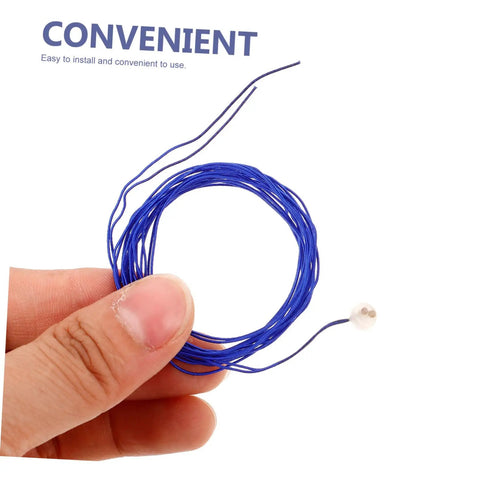 Hand holding blue Epee Body Cord Cable For Fencing Durable And Pro Grade with impact-resistant design