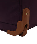 Close-up of Lightweight 15 Inch Carry On Luggage With Dual Spinner Wheels, showing brown wheel casing, purple fabric, and stitching.