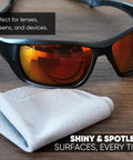Gray microfiber lens cleaning cloths, 8x8 in, two shown on wooden surface; for lenses and screens on devices