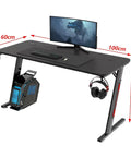 Dope Rose Pink Gaming Desk With Rgb Ambient Glow Spacious Pc Worktable For Home Office And Bedroom Setup Height Adjustable Standing Table For Teens And Students with monitor and accessories.
