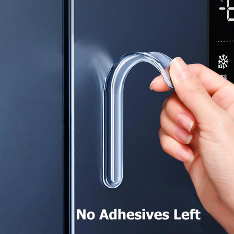 Hand removing extra long silencer pad from surface, showing no residue left. Extra Long Silencer Pads 20 Pack For Soft Close And No Slams Ultra Quiet Dampers To Protect Doors Walls Handles Chairs And Fridges Anti Slam Bumpers Durable.