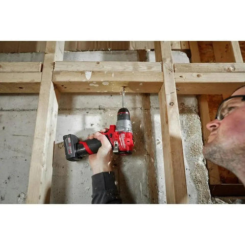 M12 Fuel Cordless Hammer Drill Kit Delivering Knockout Torque And Slick Grip Handling used to drill into concrete framing.