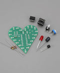 Two Piece Heart Shaped LED Soldering Practice Kit With Flashing Lights For DIY Electronics Projects components on gray background