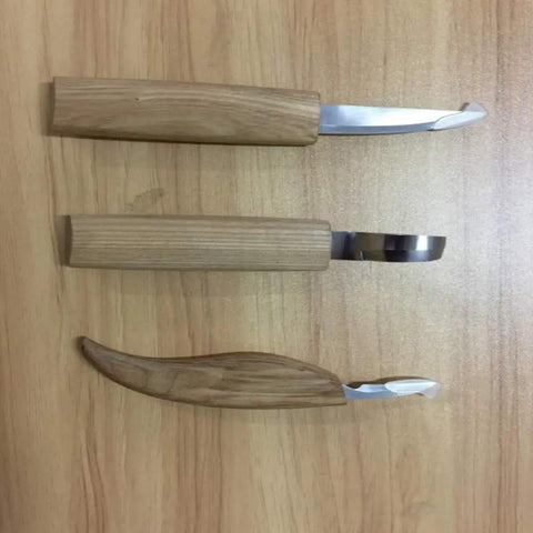 Premium Wood Carving Tools Kit Includes Hella Sharp Sloyd Knife And Hook Blade With Chip Carver, three tools with wooden handles.