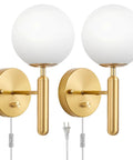 Pair of modern glass globe shade wall sconces in brass finish with 6.5-inch plug cable for bedroom and living room.