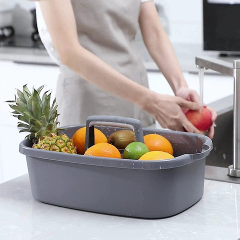 Must Have Cleaning Caddy Organizer With Handy Handle, Portable Shower Basket containing assorted fruits on kitchen counter