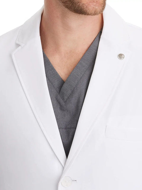 Close-up of Relaxed Fit Men's Lab Coat With 5 Pockets, Side Slits, Knit Details And 360 Degree Stretch For Easy Movement, White, 34.5 Inch Back Length, X Large on male model.