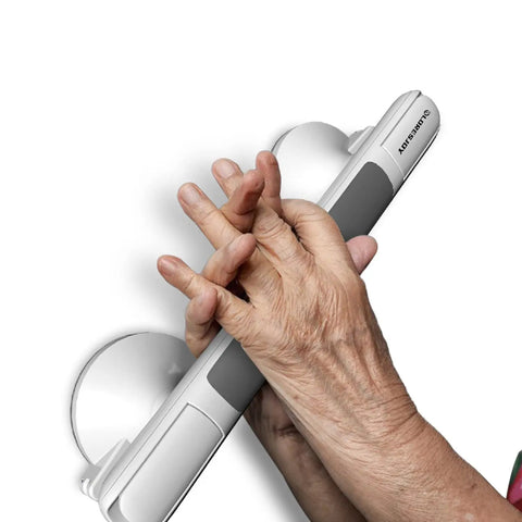 Elderly hand gripping 12 Inch Shower Handles For Elderly Suction Grab Bars No Drill Waterproof with Indicators on wall