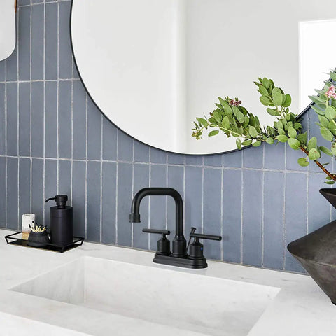 Matte Black 4 Inch Centerset Bathroom Faucet With Two Handles High Arc Lavatory Sink Tap Lift Rod Drain Stopper And 360 Degree Rotation For Modern Vanity against blue tile wall