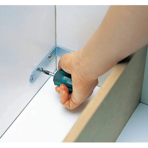 Using the Tang-Thru Screwdriver Set 8-Piece With EVA Foam Case on a metal bracket, showing durable tang-thru design.
