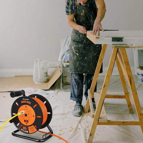 80 Ft Heavy Duty Retractable Extension Cord Reel With 4 Grounded Outlets, 13A Circuit Breaker in a workshop setting