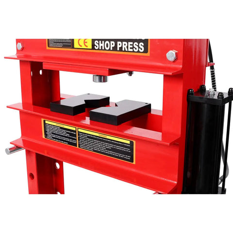 Professional Grade 30 Ton Air Hydraulic Shop Press With Precision Gauge And Adjustable H Frame Design For Garage Floor Ready Builds And No Sweat Bearing Bushing Ball Joint Removal Jobs close-up of red structure with pressing plates