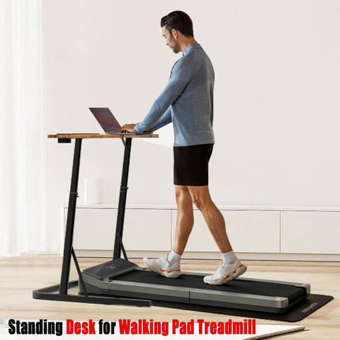 Person using Adjustable Standing Desk For Treadmills And Bike Workouts with laptop on a treadmill in a home office.