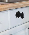 Industrial Vintage Iron Pipe Cabinet Handles Two Pack Retro Open Plan Style Cupboard Door Pulls installed on a white cabinet