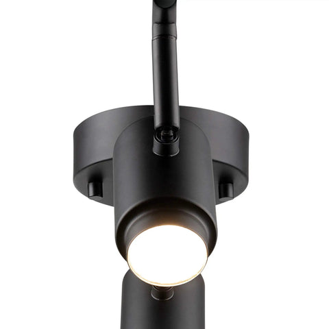 Close-up of matte black spotlight bulb of Walton 4-Light Integrated LED Track Lighting System in Matte Black, Center Swivel Bar, 1800 Lumens, 3000K.