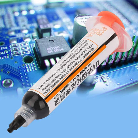 Light Curing Solder Mask Ink In Black For PCB And BGA Repair tube on blue circuit board background