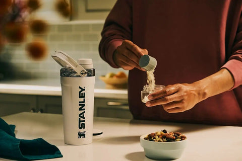 No Sweat Leakproof 20 Oz Hot Pink Shaker Bottle With Secure Hinge Lid And Fast Flow Spout Portable Tritan Protein Cup on a kitchen counter