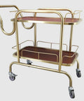 Knockout Two Tier Serving Cart Built Tough With Smooth Ride Casters Stainless Steel Kitchen Bar Trolley with gold frame and wooden shelves.