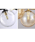 Modern Chandeliers for Dining Room Pendant Lights Hanging Lamps for Ceiling Indoor Lighting Glass Balls in clear and amber glass.