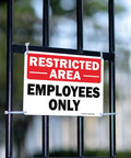 Dang Solid Metal Restricted Area Sign And Employees Only Plate Two Piece Set 10 By 7 Inch attached to a fence barrier.