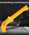 Safety Yellow Push Stick with No Slip Grip Handle for table saw woodworking, ABS build, resting on a woodworking table.
