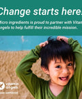 Smiling child with hands on head beneath text supporting Vitamin Angels partnership.