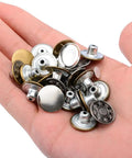 Hand holding 80 Piece Jeans Button Kit With 17mm Metal Snaps In 8 Styles Replacement Set For Jeans Denim Jackets Leather Pants