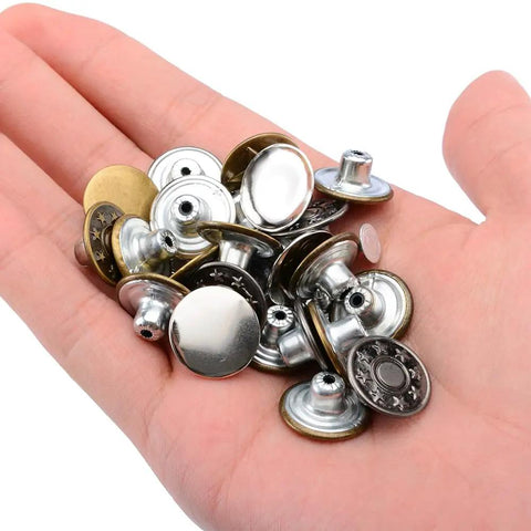 Hand holding 80 Piece Jeans Button Kit With 17mm Metal Snaps In 8 Styles Replacement Set For Jeans Denim Jackets Leather Pants