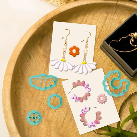 Hella Awesome Mini Flower Polymer Clay Cutters For Crafting Chic Daisy Rose Lotus Shapes With Top Shelf Hobby Molds on a wooden tray.