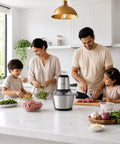 Homeasy Electric Food Chopper in a modern kitchen while family prepares meat, vegetables, and herbs together.