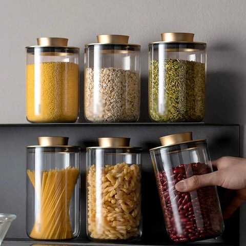 Top Notch Slick Large Glass Kitchen Jars Set Of Four Aluminum Lids with pasta and beans on a shelf, perfect for countertop organization.