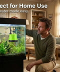 Man admiring fish tank with Submersible Pump For Fish Tanks Ponds Aquariums And Hydroponics 660 GPH Flow 40W Green