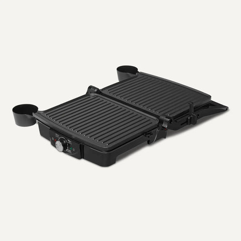 Amazon Basics Panini Press And Electric Indoor Grill With Adjustable Temp Settings Non Stick Ceramic Plates Black in open position.