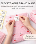 Hands sealing a pink bubble mailer 6x10 inch 100 pack waterproof self seal padded envelopes with cherry design and thank you sticker