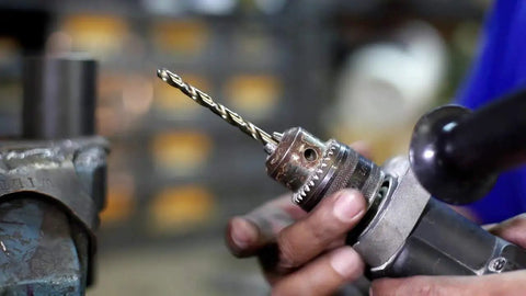 Fifteen Sixteenths Inch Cobalt Steel Taper Length Drill Bit DWDTL Series Built Tough for Stainless Steel and Hard Metals in use.