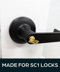Brass key inserted in black door handle, showing Brass Key Blanks for 5 Pin Locks, Uncut 10 Pack, Durable Premium Brass for Home and Pro Use.