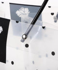 Close-up of clear plastic flower packaging bags with handle for bouquets, polka dot design, durable, for weddings and Valentine gifts.
