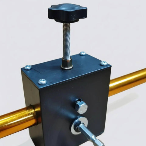 Close-up of pro-grade aluminum wire puller for snappy cable feeding. Features black metal body and golden pull bar.