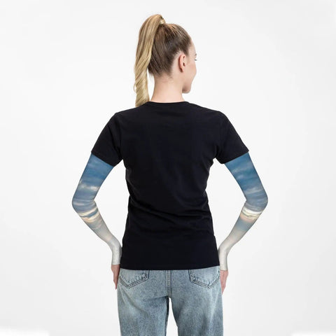 Back view of person wearing Ice Silk Arm Sleeves for Outdoor Comfort with Moisture Wicking Breathable Fabric and Sailing Sunset Scene pattern