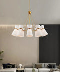 White Horn Pendant Chandelier Featuring Brass Accents And Glass Shades Adjustable Hanging Chain For Modern Farmhouse Living Room Bedroom Hallway Decor Eye Catching Statement Piece Amp Up Your Space Vibe Today in stylish living room setting.