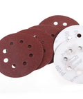 Super Tough 5 Inch Hook And Loop Sanding Discs With Eight Holes For Dustless Vibes, showing red and white sanding discs for surface conditioning.