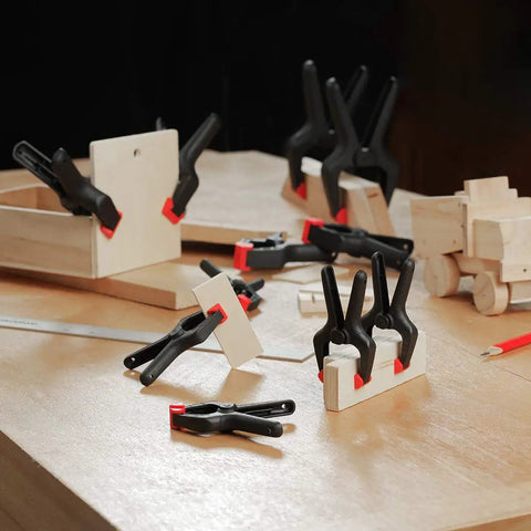 Heavy Duty Nylon Spring Clamp Set in use on woodworking project, featuring 16 piece set with 6-1/2, 4-1/2, 3-3/8 inch clamps