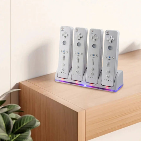 4 In 1 Game Controller Charging Station With Four Rechargeable Battery Packs And USB Cable, controllers docked on a desk