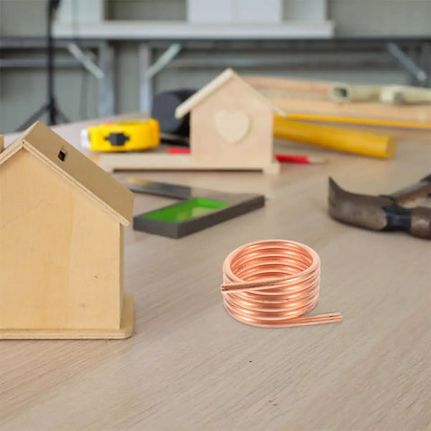 RC Boat Water Cooling Ring Kit For Brushed Motors Copper Cooling Jacket on a workbench with DIY tools and wooden model houses