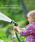 Child using garden hose with 3/4 inch universal fit nozzle, showcasing outdoor use of quick connect set.