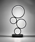 Four Circle Dimmable LED Table Lamp With Color Adjustable Light Modern Round Design 12W Black Finish Sleek Desk Lamp On Surface