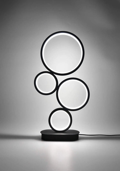 Four Circle Dimmable LED Table Lamp With Color Adjustable Light Modern Round Design 12W Black Finish Sleek Desk Lamp On Surface